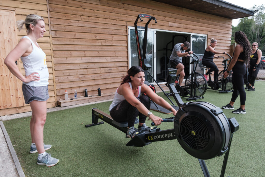 Members using endurance kit-rowers and ski ergs